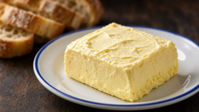 Block of fresh homemade butter on a white plate